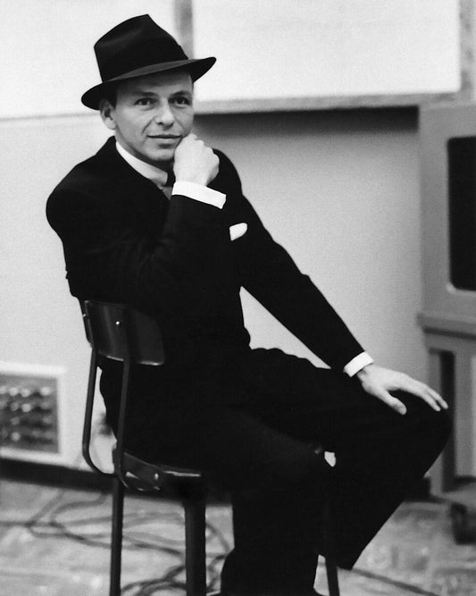 Frank Sinatra wearing a fedora, 1957 studio portrait (public domain)
