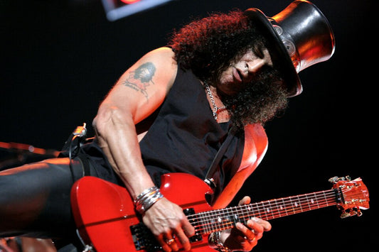 Slash of Guns N' Roses performing in his signature black top hat